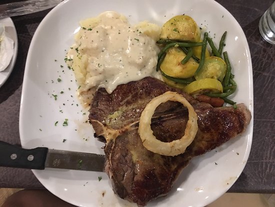 Gorat's Steakhouse signature dishes T-Bone Steak, Filet Mignon with Hash Browns, Prime Rib, Chicken Parmigiana